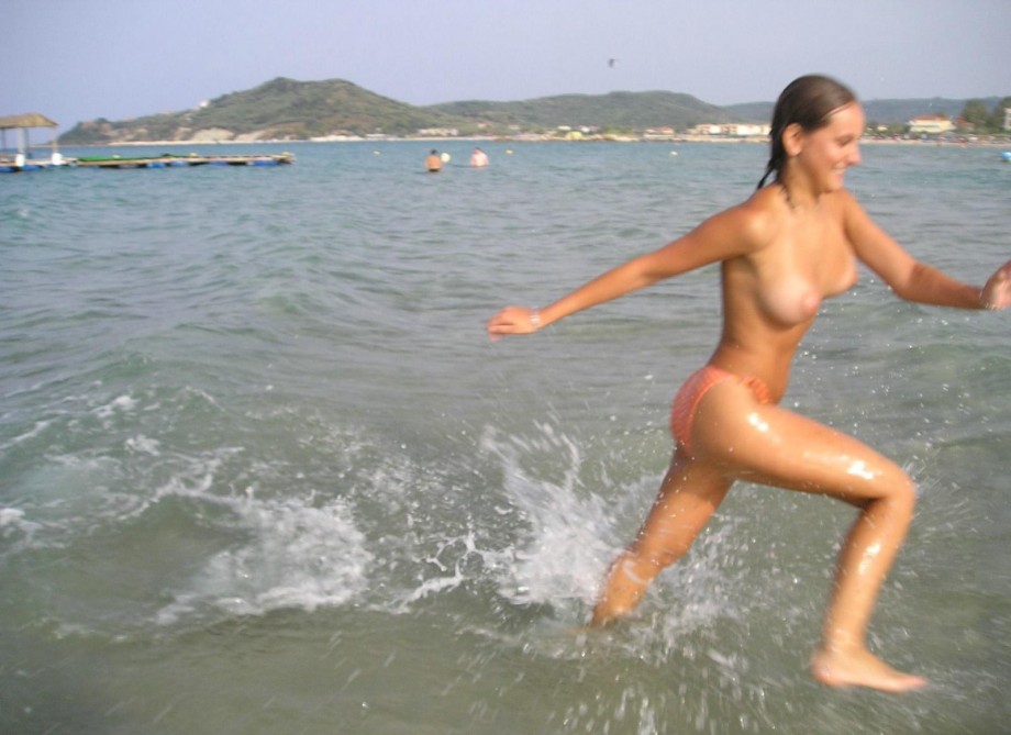 Pretty girl topless at beach 