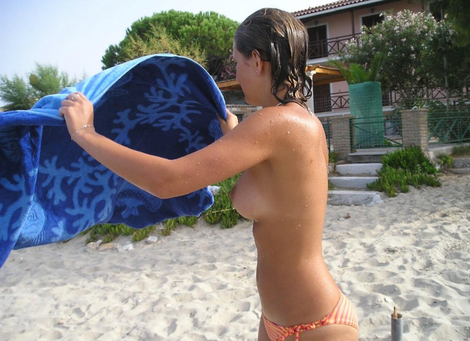 Pretty girl topless at beach 