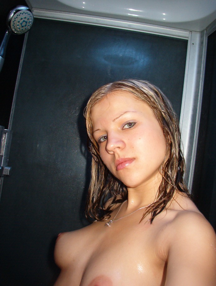 Hot blonde masturbates in the shower