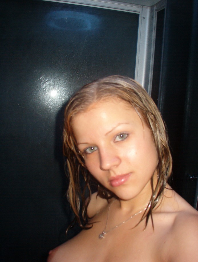 Hot blonde masturbates in the shower