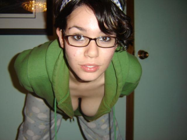Geeky cutie showing off her great tits
