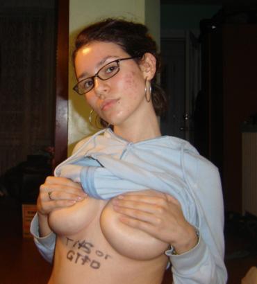 Geeky cutie showing off her great tits