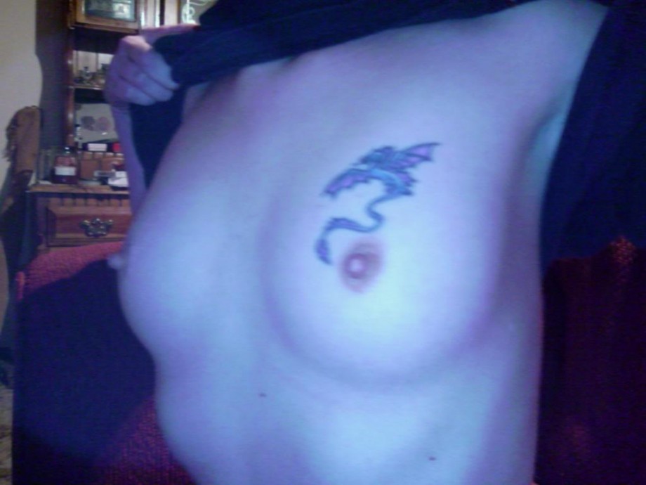 Tattoo brunette posing