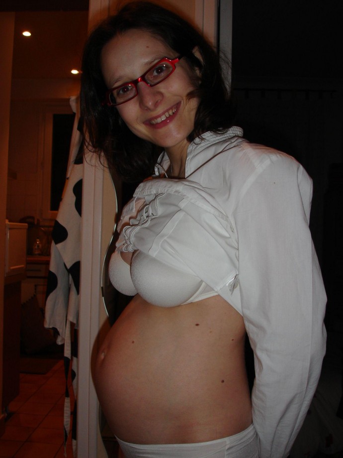 Pregnant milf with glassesposing 