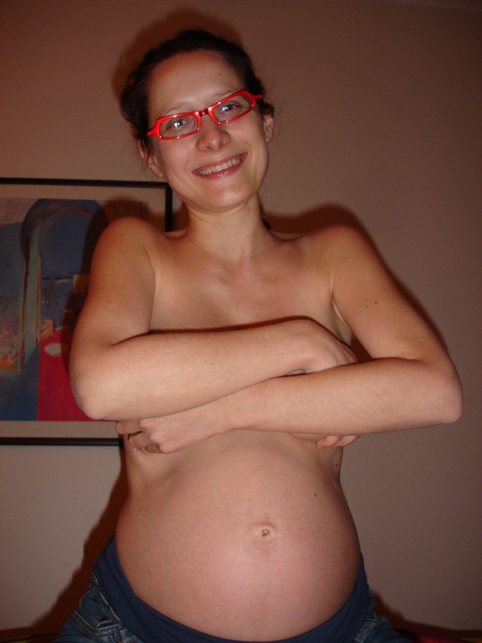 Pregnant milf with glassesposing 