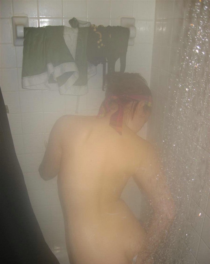 Sexy girl  shaving in the shower 