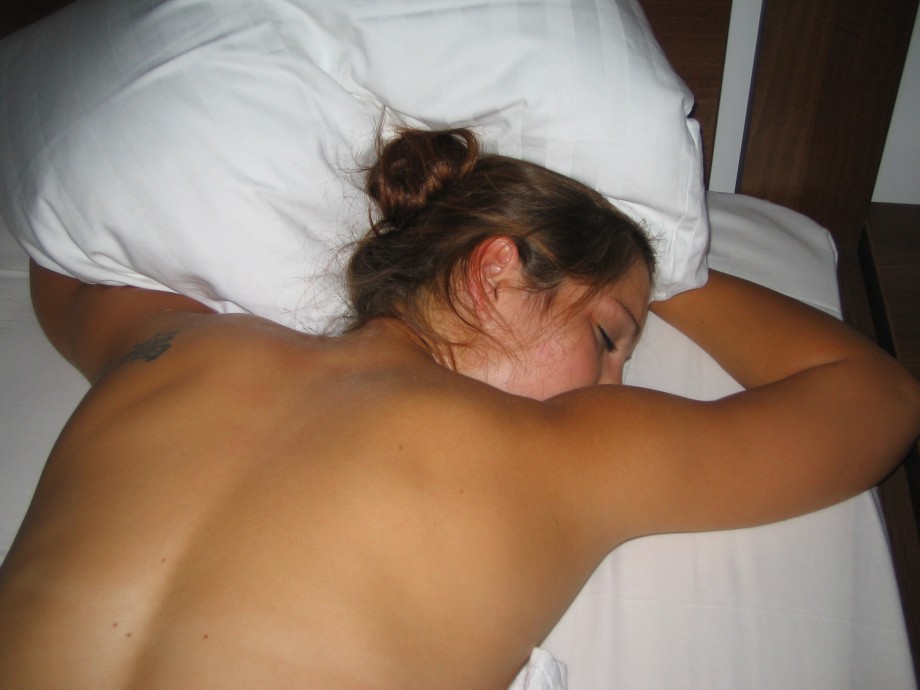 Shaved naked girlfriend on the bed