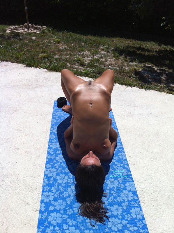 Summer naked yoga on garden