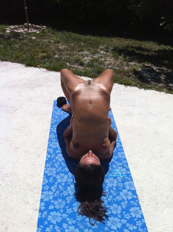 Summer naked yoga on garden