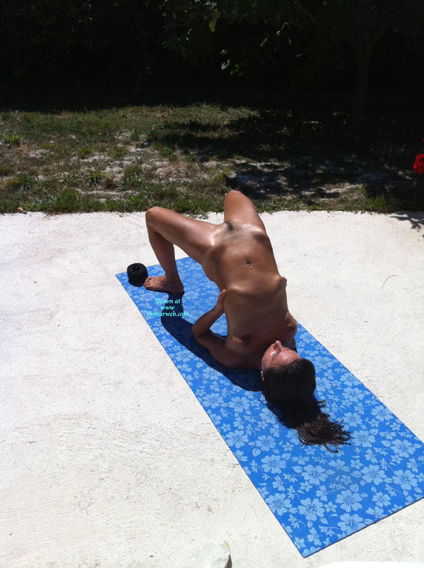 Summer naked yoga on garden