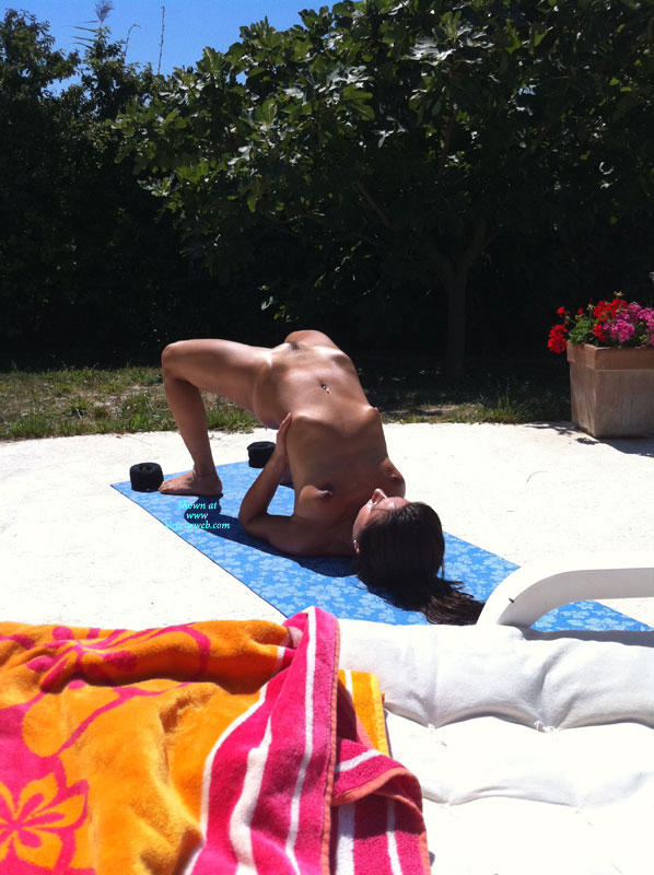 Summer naked yoga on garden