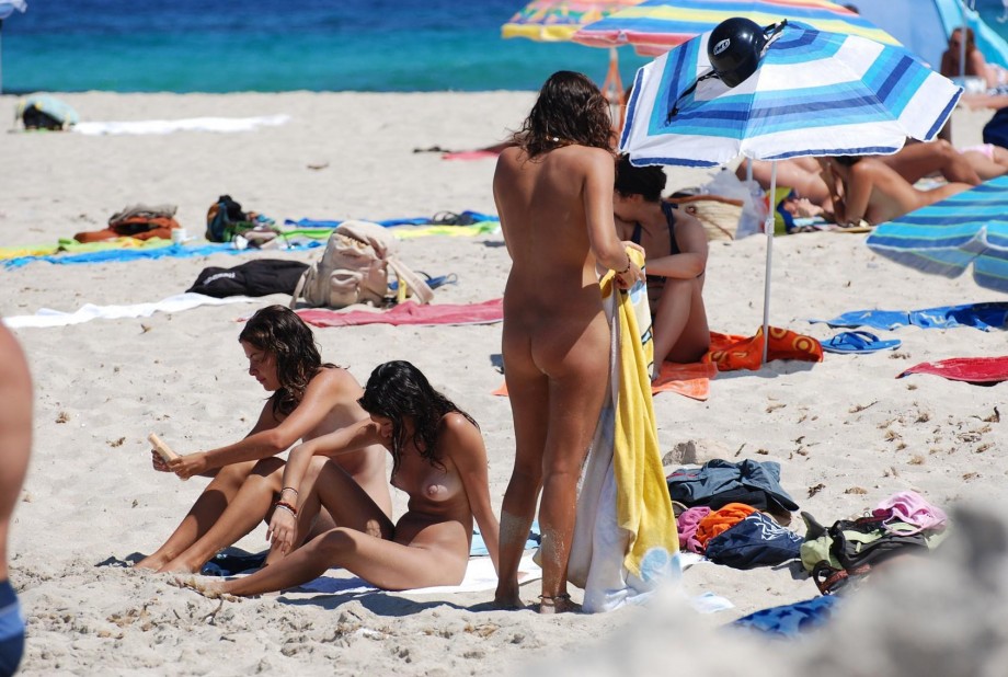 Three hot teens on the nudist beach 1