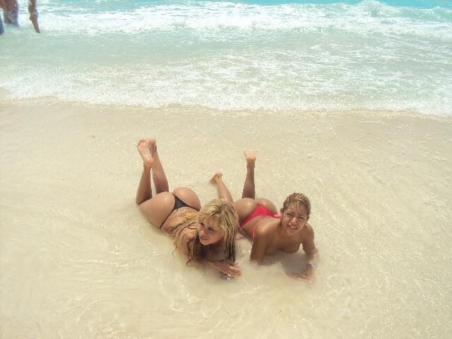 2 blonde latinas posing on the beach