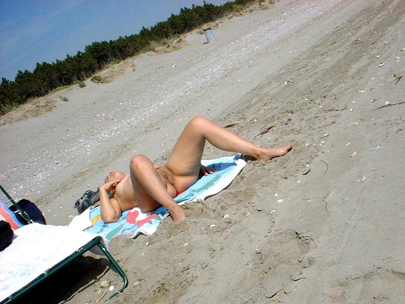 Young brunette girlfriend on the beach