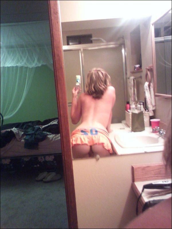 Selfshots - blonde girl in front of mirror