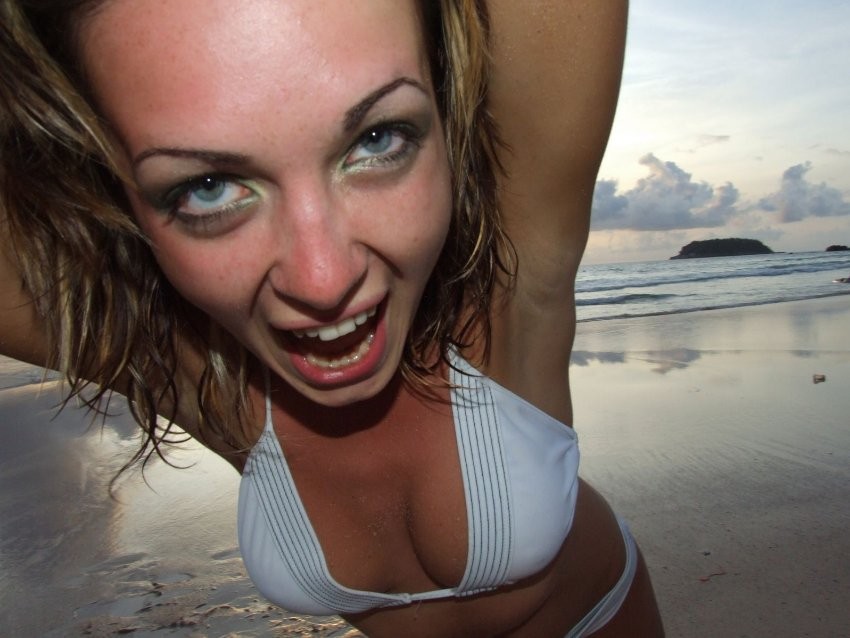 Beauty girl poses on beach