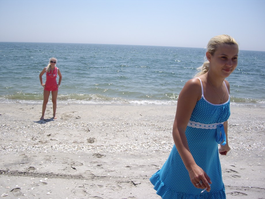 Licking lesbians on beach