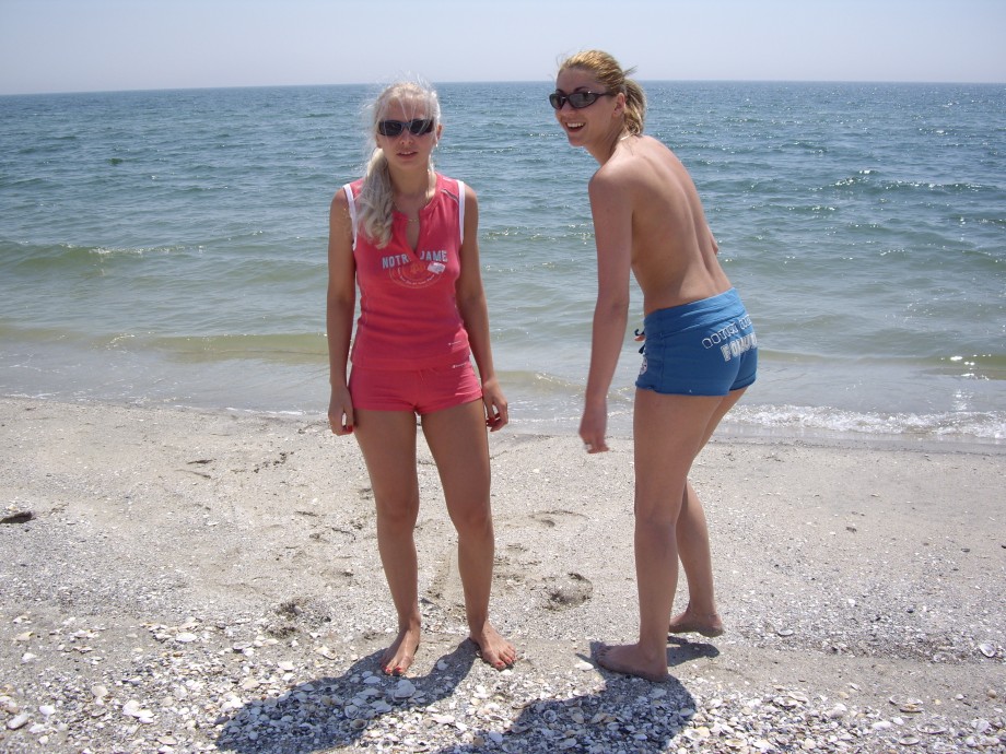 Licking lesbians on beach