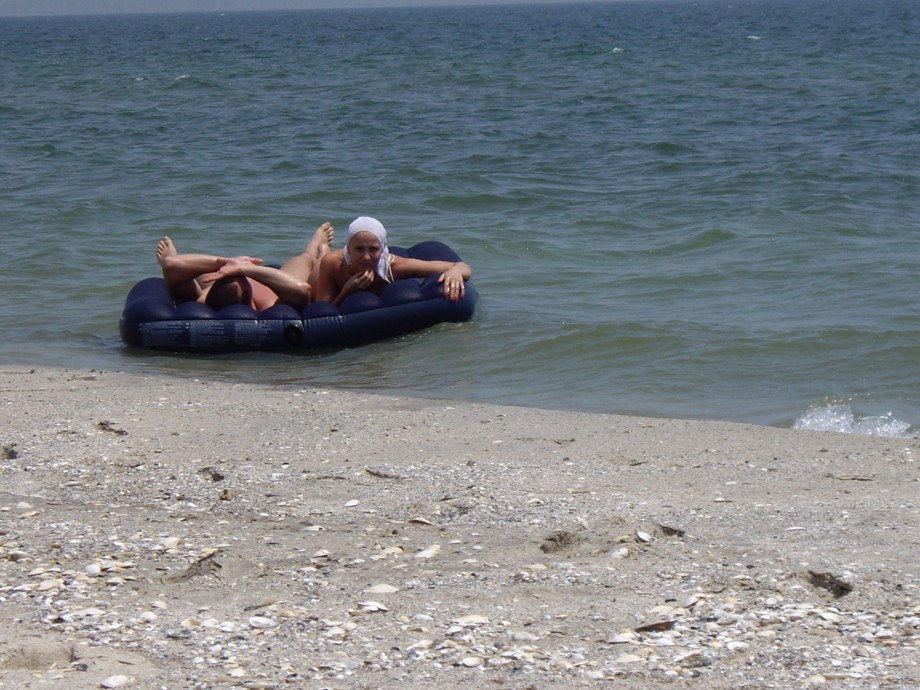 Licking lesbians on beach