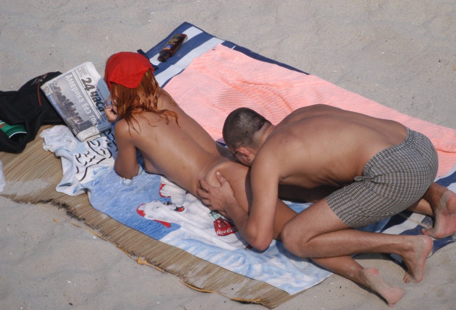 Girl with two boys on nude beach