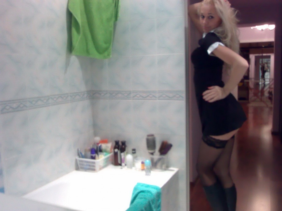 Blond naked girl in bathroom