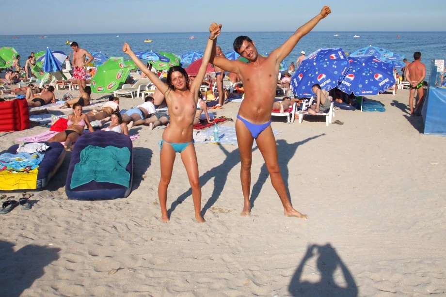 Topless girlfriend on the beach