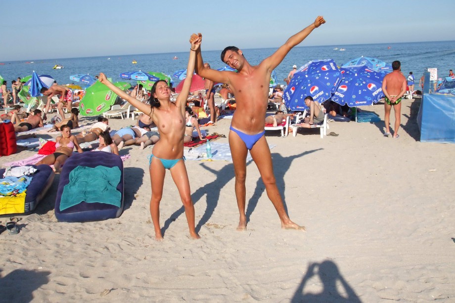 Topless girlfriend on the beach