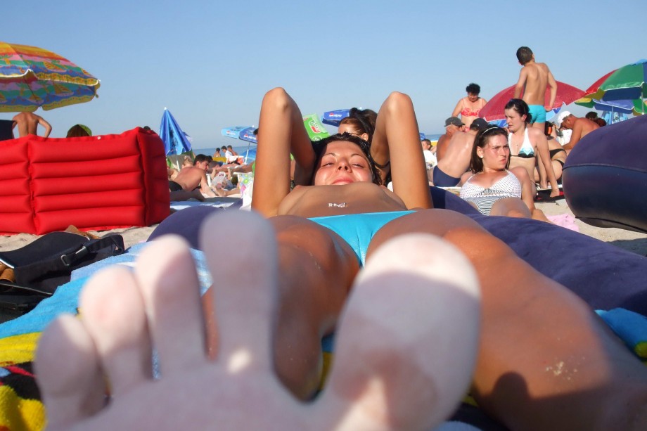 Topless girlfriend on the beach