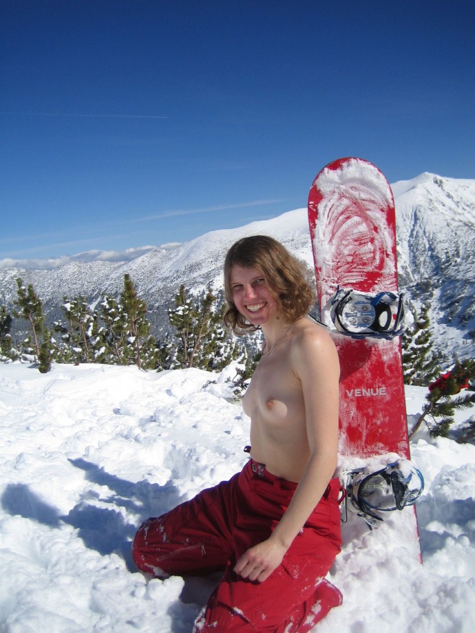 Topless on snowboard