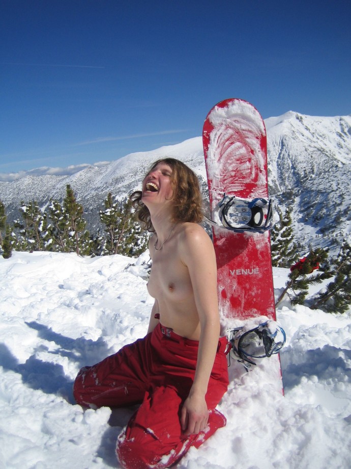 Topless on snowboard
