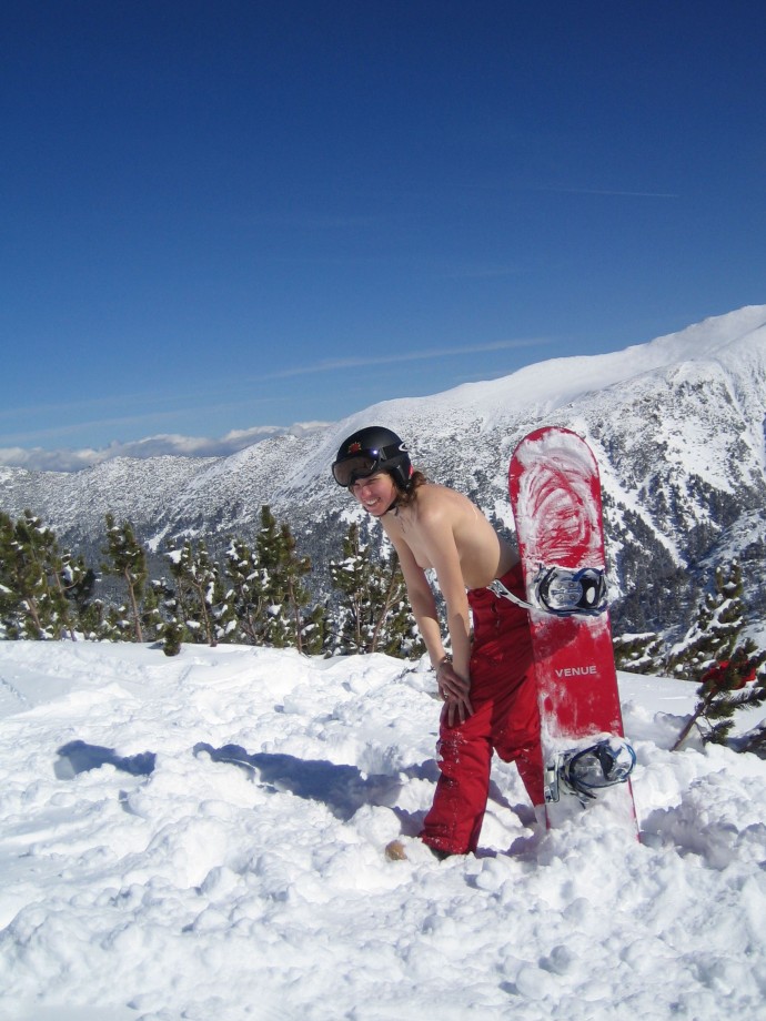 Topless on snowboard