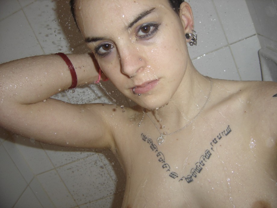 Tatooed young naked girl