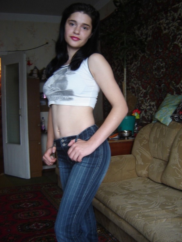 Pretty russian brunette posing at home