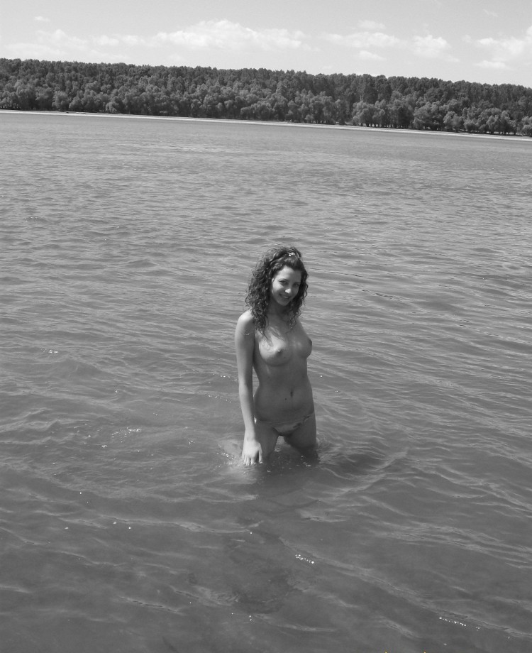 Curly nudist teen at lake