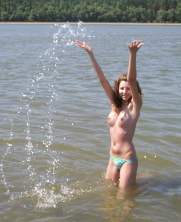 Curly nudist teen at lake