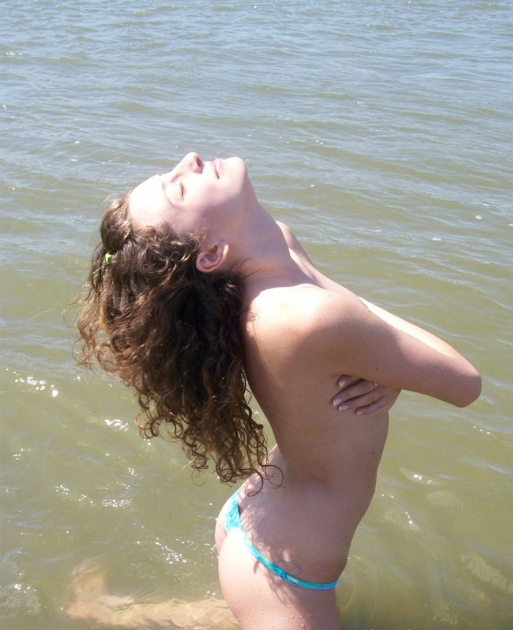 Curly nudist teen at lake