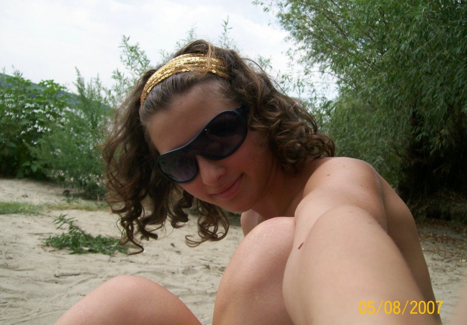 Curly nudist teen at lake