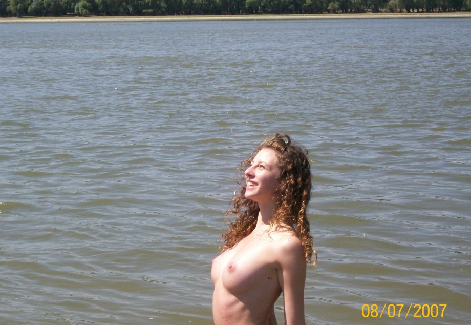 Curly nudist teen at lake