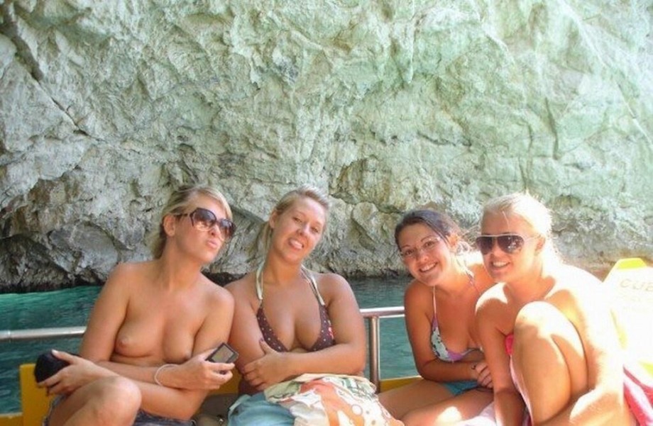Nude or topless girls together with clothed girls