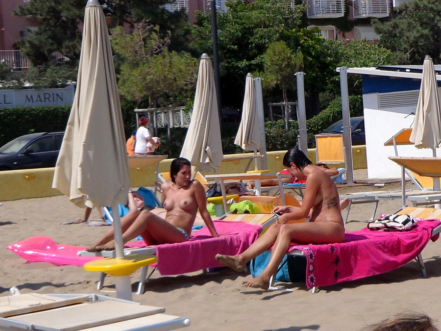 Girls sunbathing on italian beach of the adriatic coast