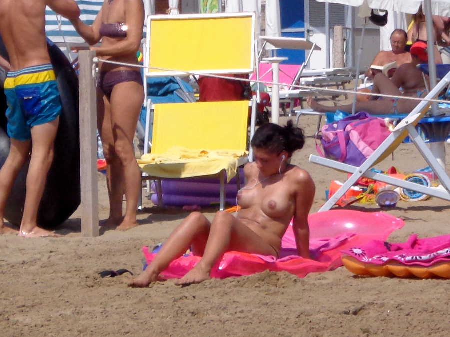 Girls sunbathing on italian beach of the adriatic coast