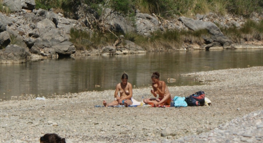 Topless nudist babes with tanga tanning in sun