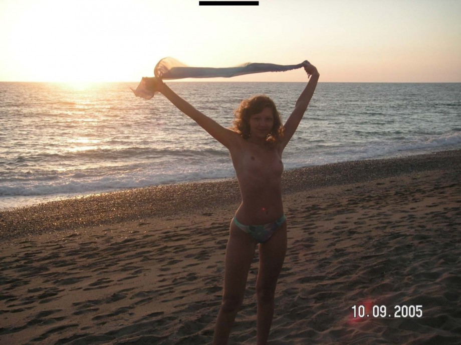 Brunette teen teasing on nude beach