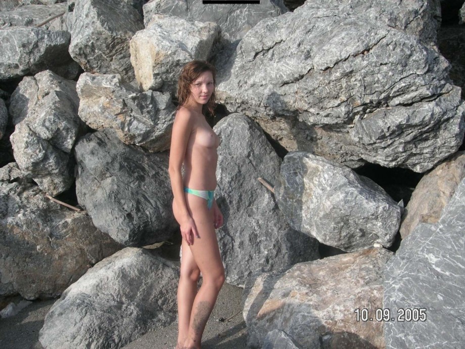 Brunette teen teasing on nude beach