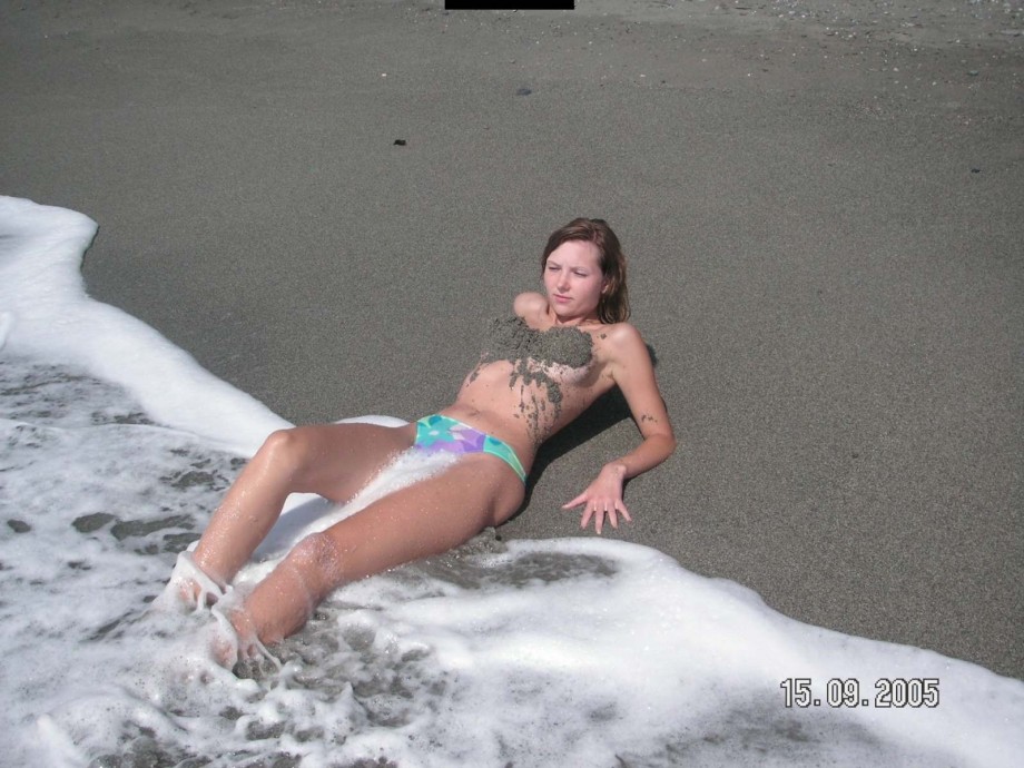 Brunette teen teasing on nude beach