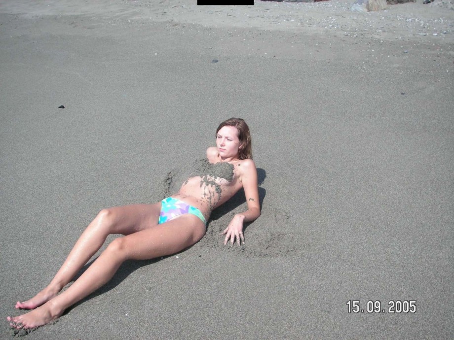 Brunette teen teasing on nude beach