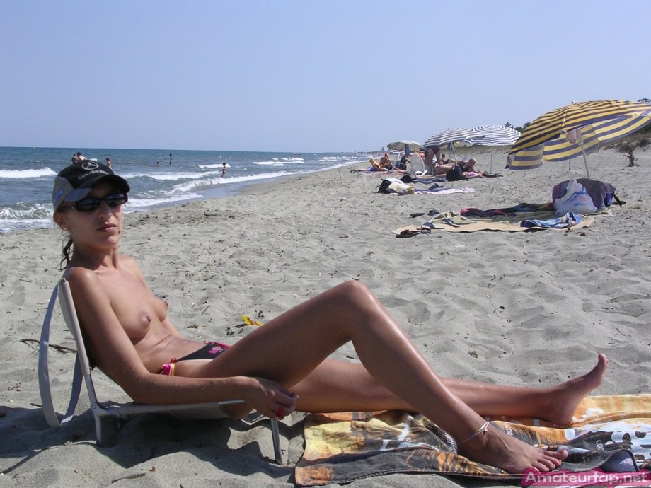 Slim milf nude on the beach
