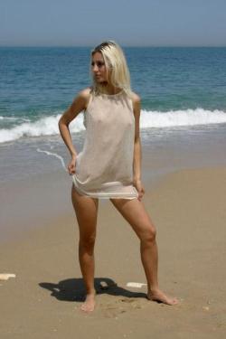 Cute blonde on nude beach  38/61