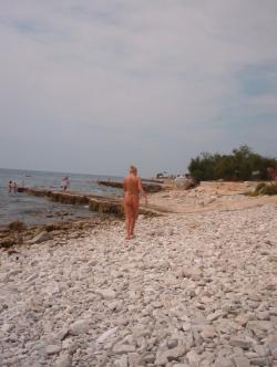 Blond girl at nudist beach 5/8