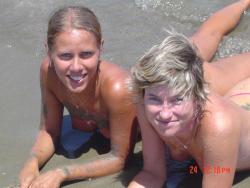 Two amateurs girl topless shot on the beach  14/48